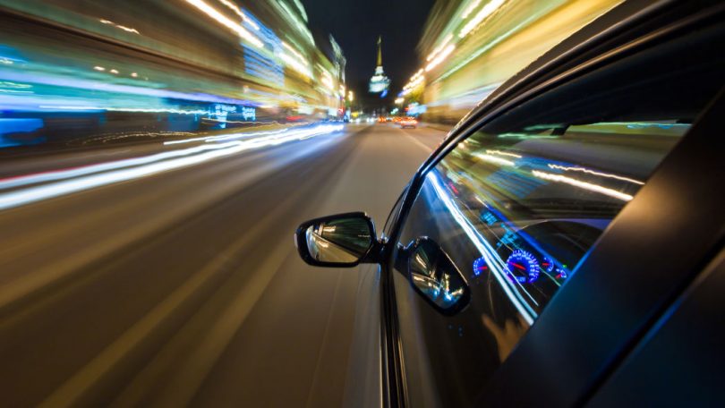 car driving fast in the night 1 810x456